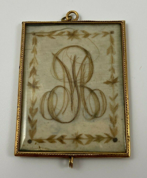Pendentif en or avec poinçon XIXe travail de cheveux