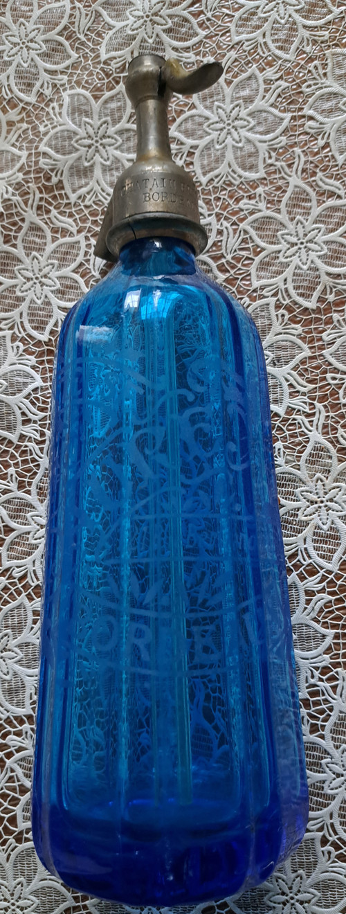 Old pyramidal siphon with blue facets for drinks in Bordeaux