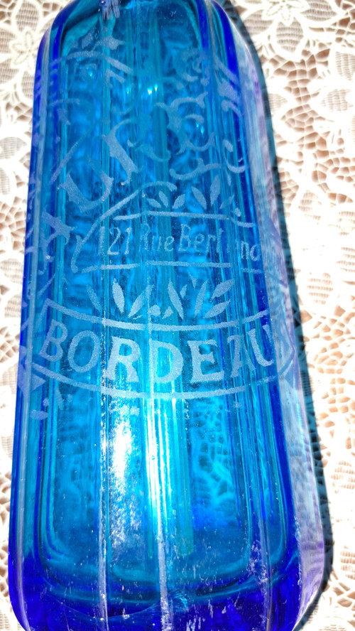 Old pyramidal siphon with blue facets for drinks in Bordeaux