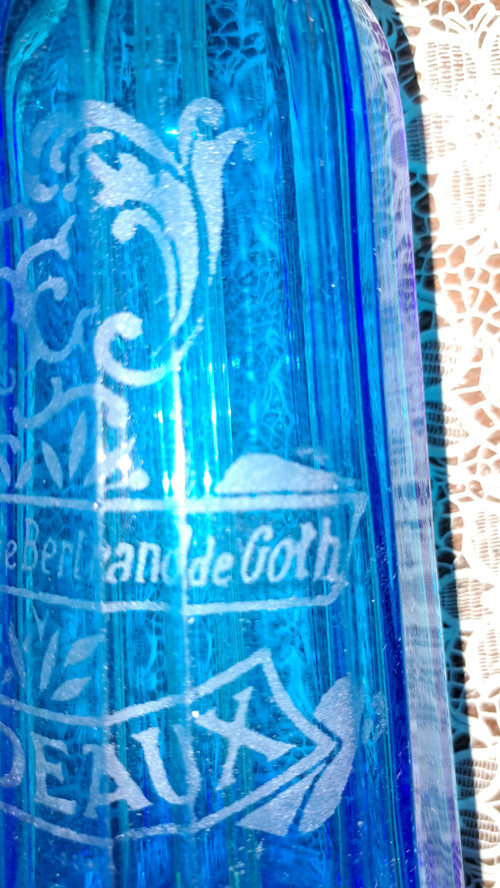 Old pyramidal siphon with blue facets for drinks in Bordeaux