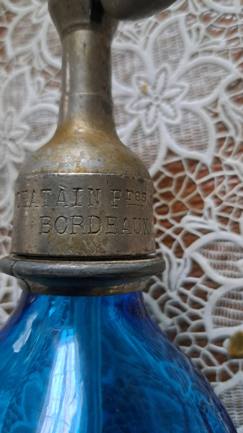 Old pyramidal siphon with blue facets for drinks in Bordeaux