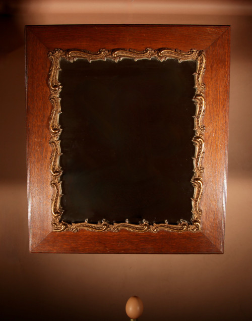 Original framed mirror in oak and gesso in the rococo style.