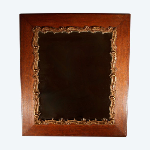 Original framed mirror in oak and gesso in the rococo style.