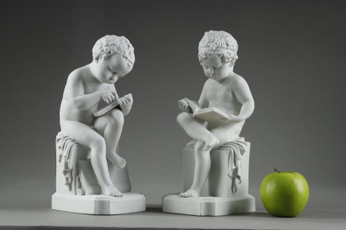 TWO SUBJECTS AT BISCUIT REPRESENTING THE CHILD READING AND THE CHILD DRAWING
