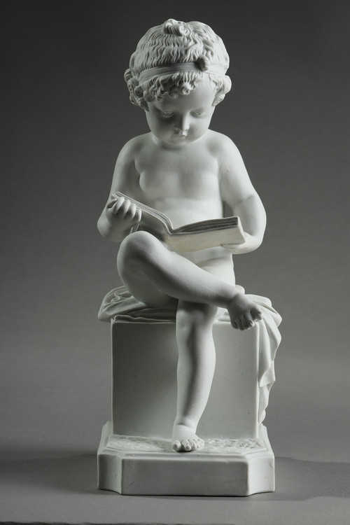 TWO SUBJECTS AT BISCUIT REPRESENTING THE CHILD READING AND THE CHILD DRAWING