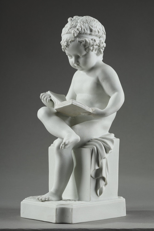 TWO SUBJECTS AT BISCUIT REPRESENTING THE CHILD READING AND THE CHILD DRAWING