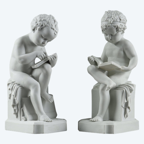 TWO SUBJECTS AT BISCUIT REPRESENTING THE CHILD READING AND THE CHILD DRAWING