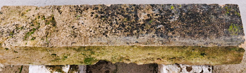 Rustic garden bench made from old stones