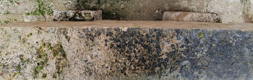 Rustic garden bench made from old stones