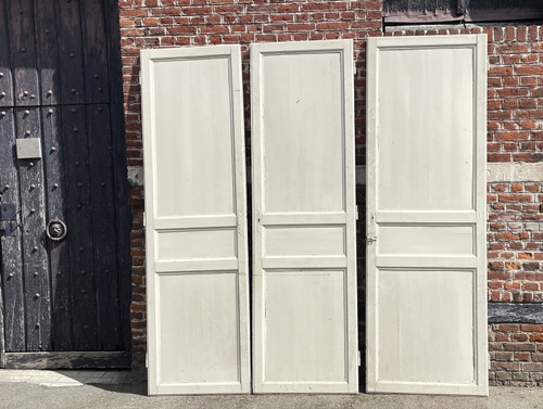 Suite of three three-panel doors
