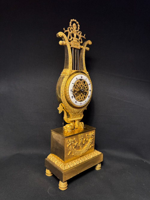 Empire period ormolu Lyre clock with dolphins