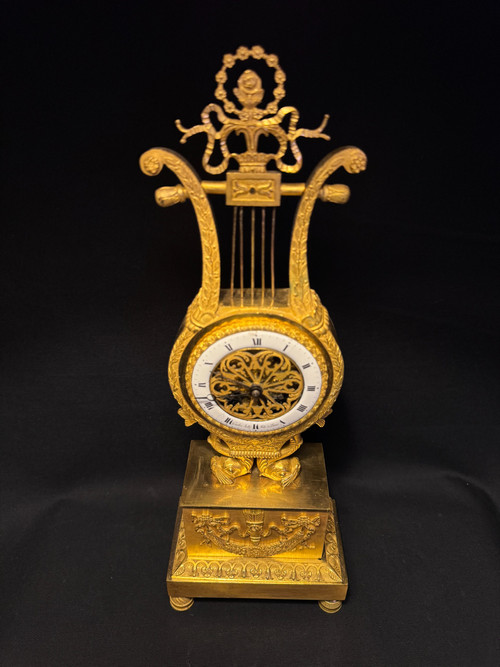 Empire period ormolu Lyre clock with dolphins