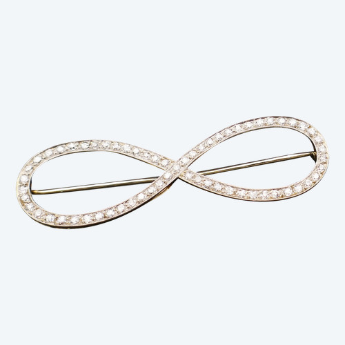 Spilla in oro bianco 18 carati e platino con diamanti.