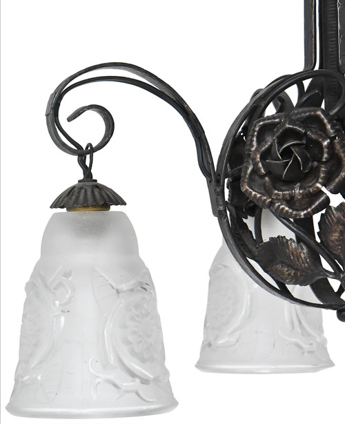 Art Deco chandelier with four molded glass tulips and wrought iron frame decorated with roses.