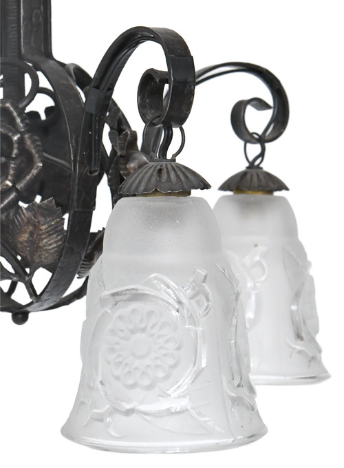Art Deco chandelier with four molded glass tulips and wrought iron frame decorated with roses.