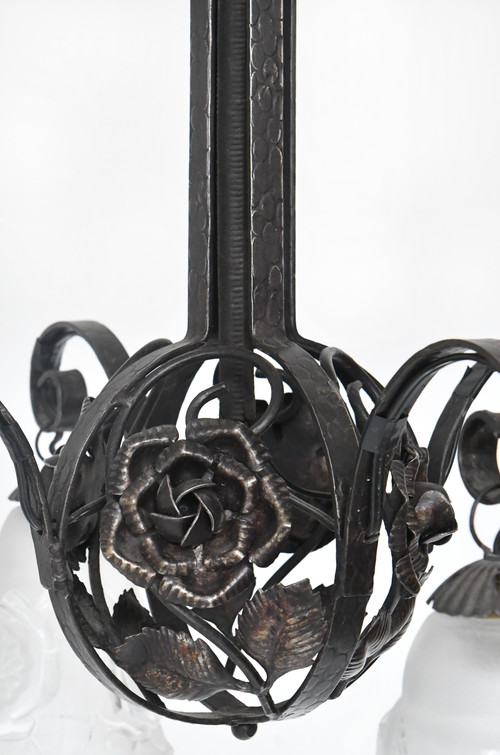 Art Deco chandelier with four molded glass tulips and wrought iron frame decorated with roses.