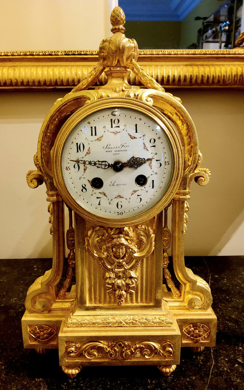 Louis XVI Style Pendulum Clock and Pair of Candlesticks in Chiseled Gilded Bronzes Susse Fd