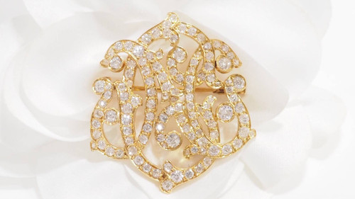 Broche volutes Art Nouveau en or jaune et diamants