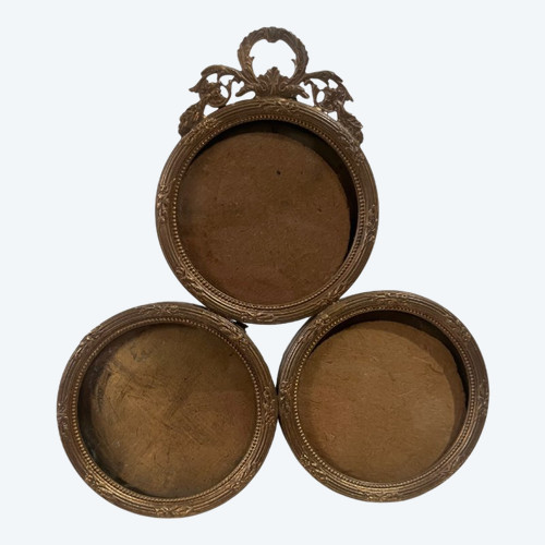 Three stacked brass picture frames