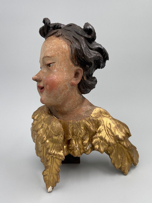 Head of a cherub in carved polychrome gilded wood, 17th century, entourage of Ignaz Günther