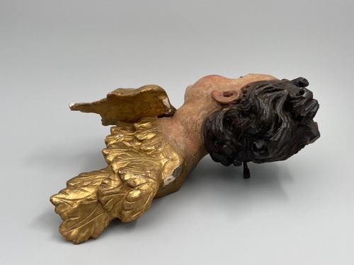 Head of a cherub in carved polychrome gilded wood, 17th century, entourage of Ignaz Günther