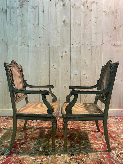 Pair of Louis XVI armchairs with re-edging and caning.