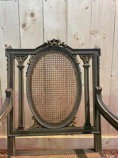 Pair of Louis XVI armchairs with re-edging and caning.