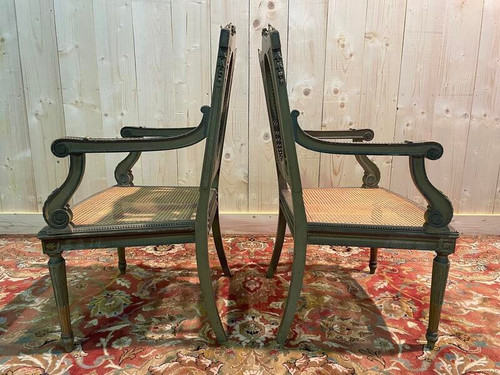 Pair of Louis XVI armchairs with re-edging and caning.