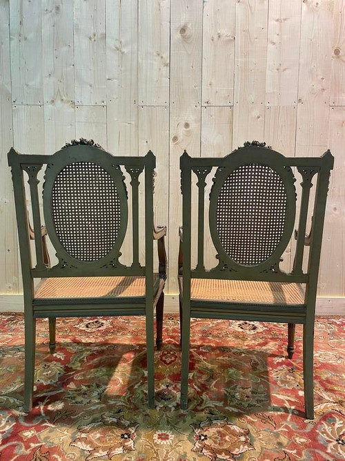 Pair of Louis XVI armchairs with re-edging and caning.