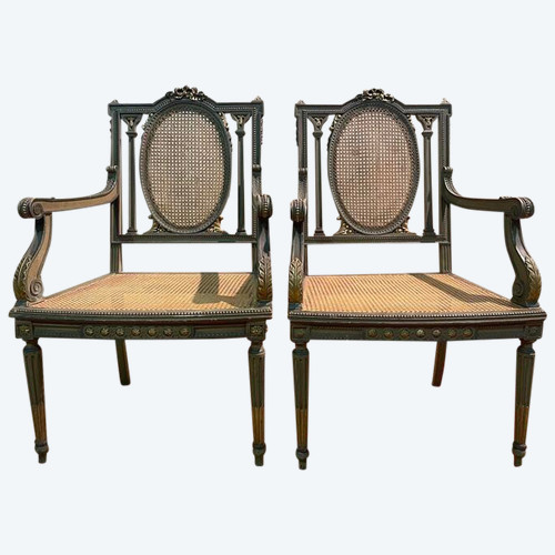 Pair of Louis XVI armchairs with re-edging and caning.