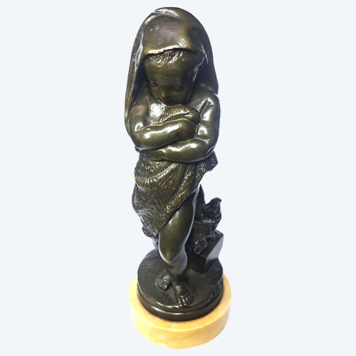 Scultura di bambino in bronzo con base in marmo