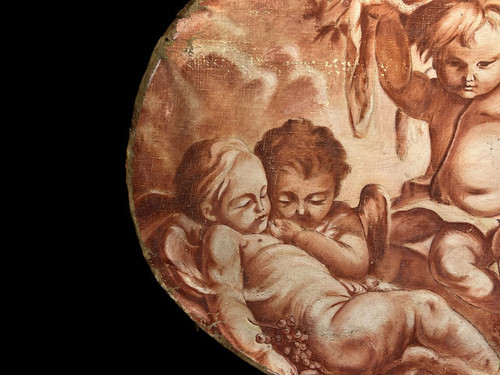 OIL ON OVAL WOOD PANELING DECORATED WITH CHERUBS CARRYING A FRUIT BOWL