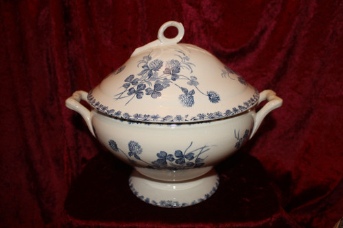Part of a table service in earthenware decorated with shamrocks in blossom, early 20th century.