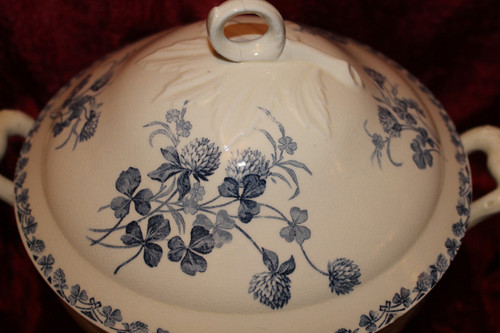 Part of a table service in earthenware decorated with shamrocks in blossom, early 20th century.