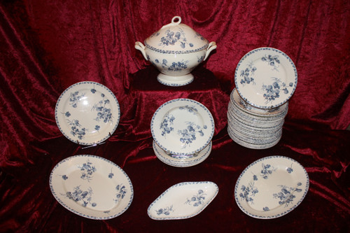 Part of a table service in earthenware decorated with shamrocks in blossom, early 20th century.