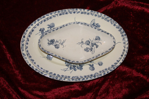 Part of a table service in earthenware decorated with shamrocks in blossom, early 20th century.