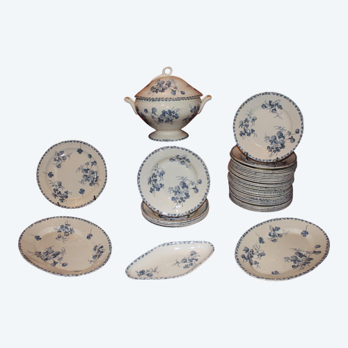 Part of a table service in earthenware decorated with shamrocks in blossom, early 20th century.