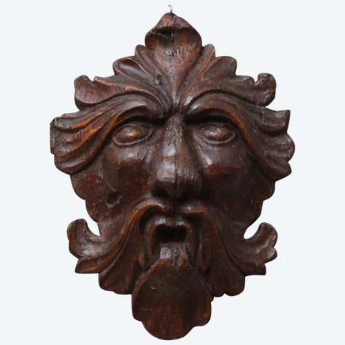 Mascaron "maschera a foglie" in legno intagliato, XVII secolo