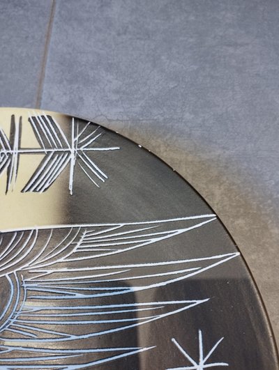Vallauris plate with incised decoration.