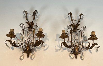 Pair of wall lights in gilded metal and crystals. French work in the style of Maison Baguès.