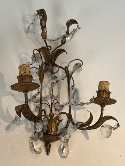 Pair of wall lights in gilded metal and crystals. French work in the style of Maison Baguès.