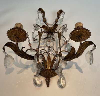 Pair of wall lights in gilded metal and crystals. French work in the style of Maison Baguès.