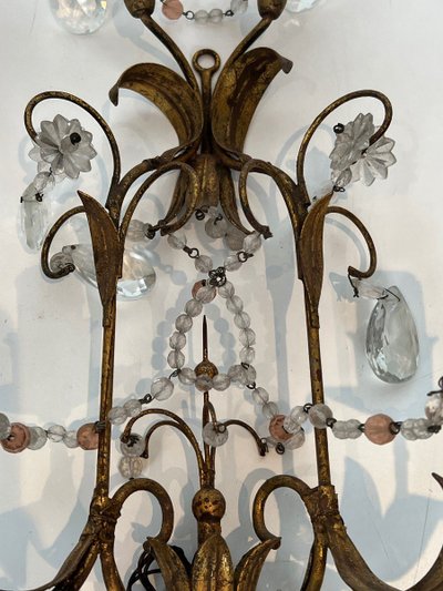 Pair of wall lights in gilded metal and crystals. French work in the style of Maison Baguès.