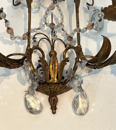 Pair of wall lights in gilded metal and crystals. French work in the style of Maison Baguès.