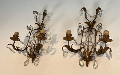 Pair of wall lights in gilded metal and crystals. French work in the style of Maison Baguès.