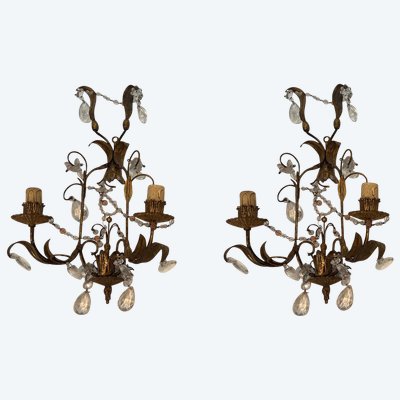 Pair of wall lights in gilded metal and crystals. French work in the style of Maison Baguès.