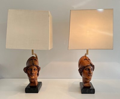 Pair of walnut lamps depicting the faces of helmeted soldiers. Italian work.
