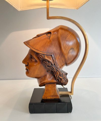 Pair of walnut lamps depicting the faces of helmeted soldiers. Italian work.