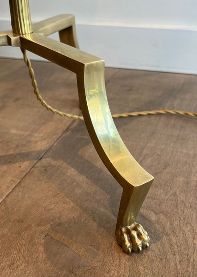 Brass reading lamp with removable, height-adjustable arm.