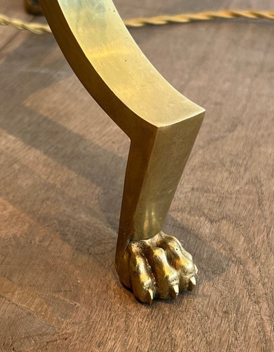 Brass reading lamp with removable, height-adjustable arm.